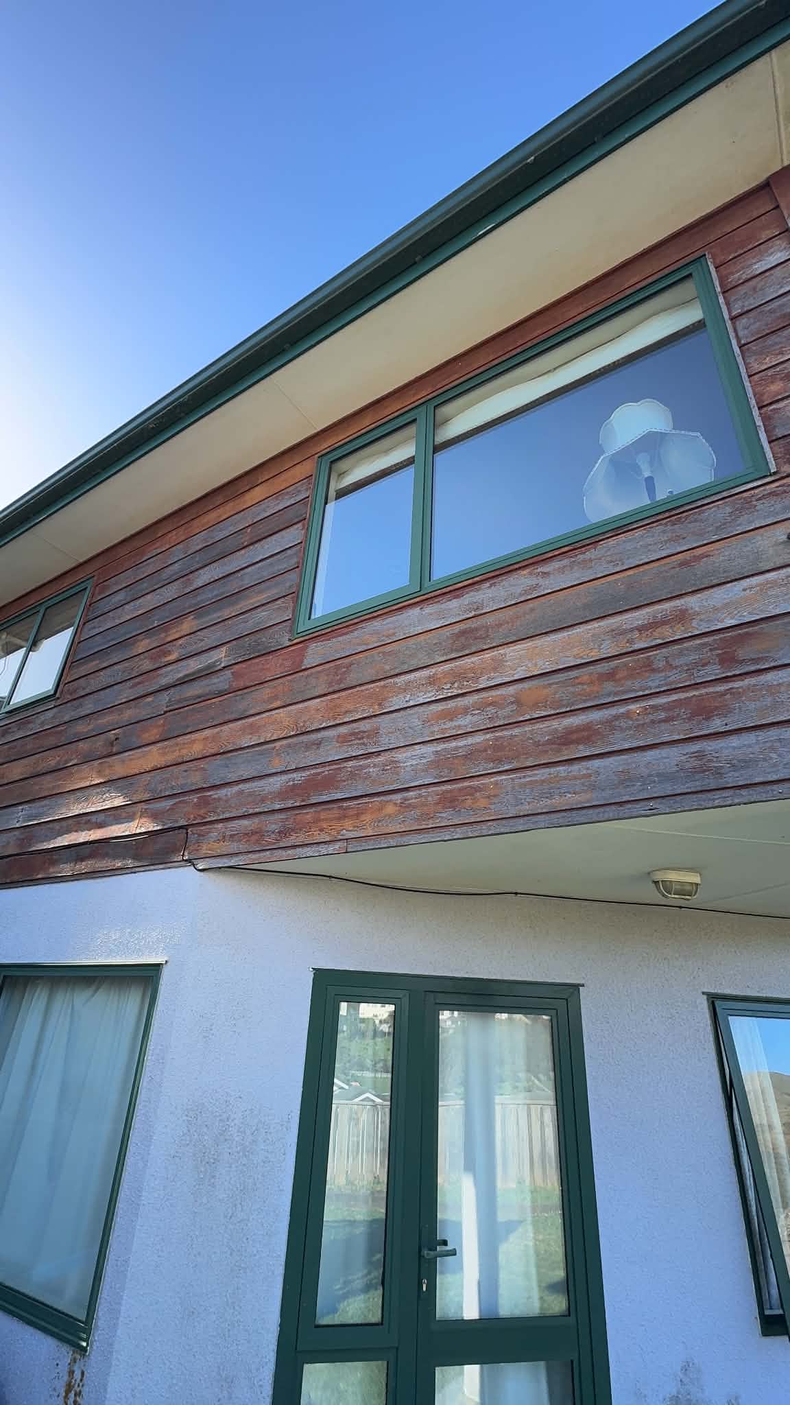 Before image of cedar cladding in Johnsonville.