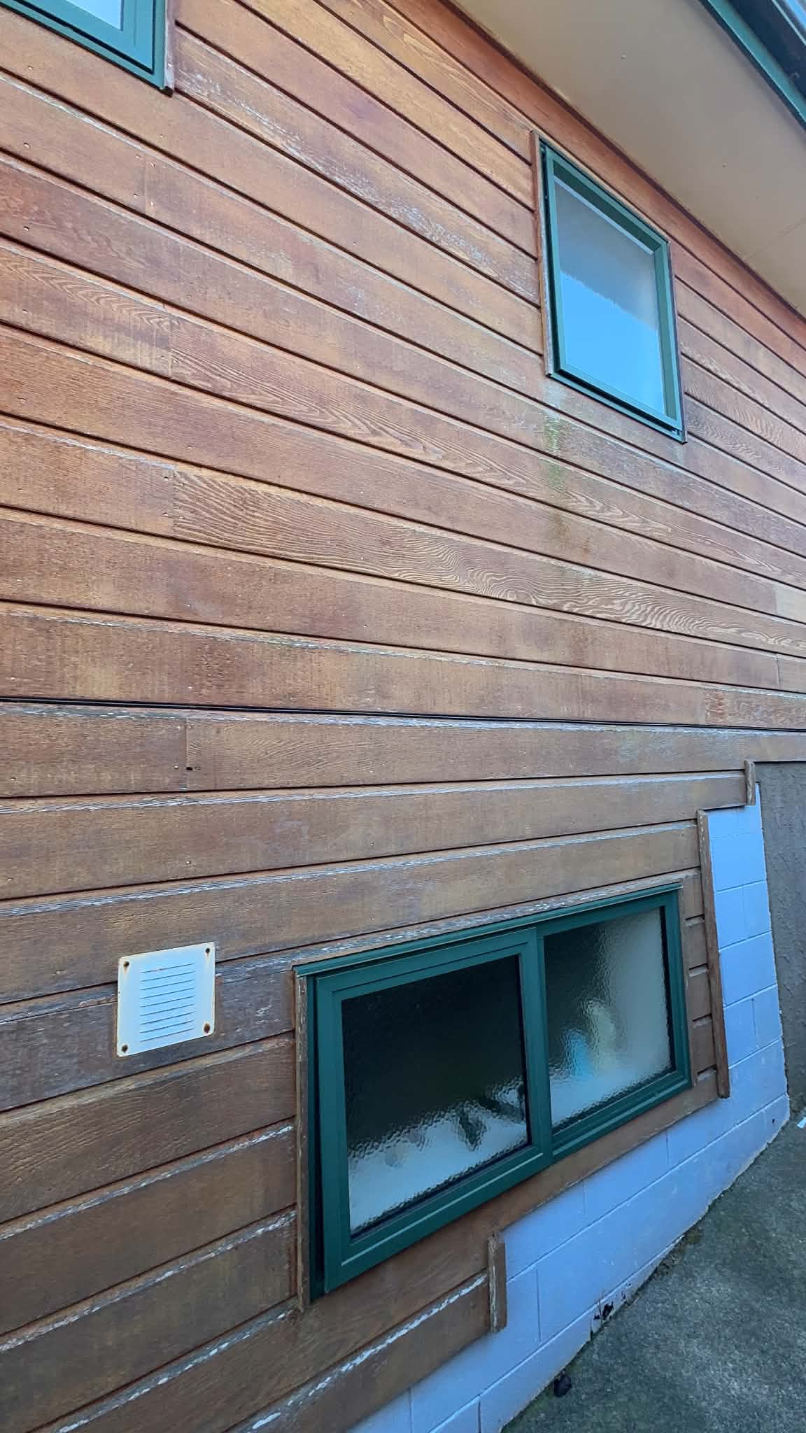 Before image of exterior cedar cladding.