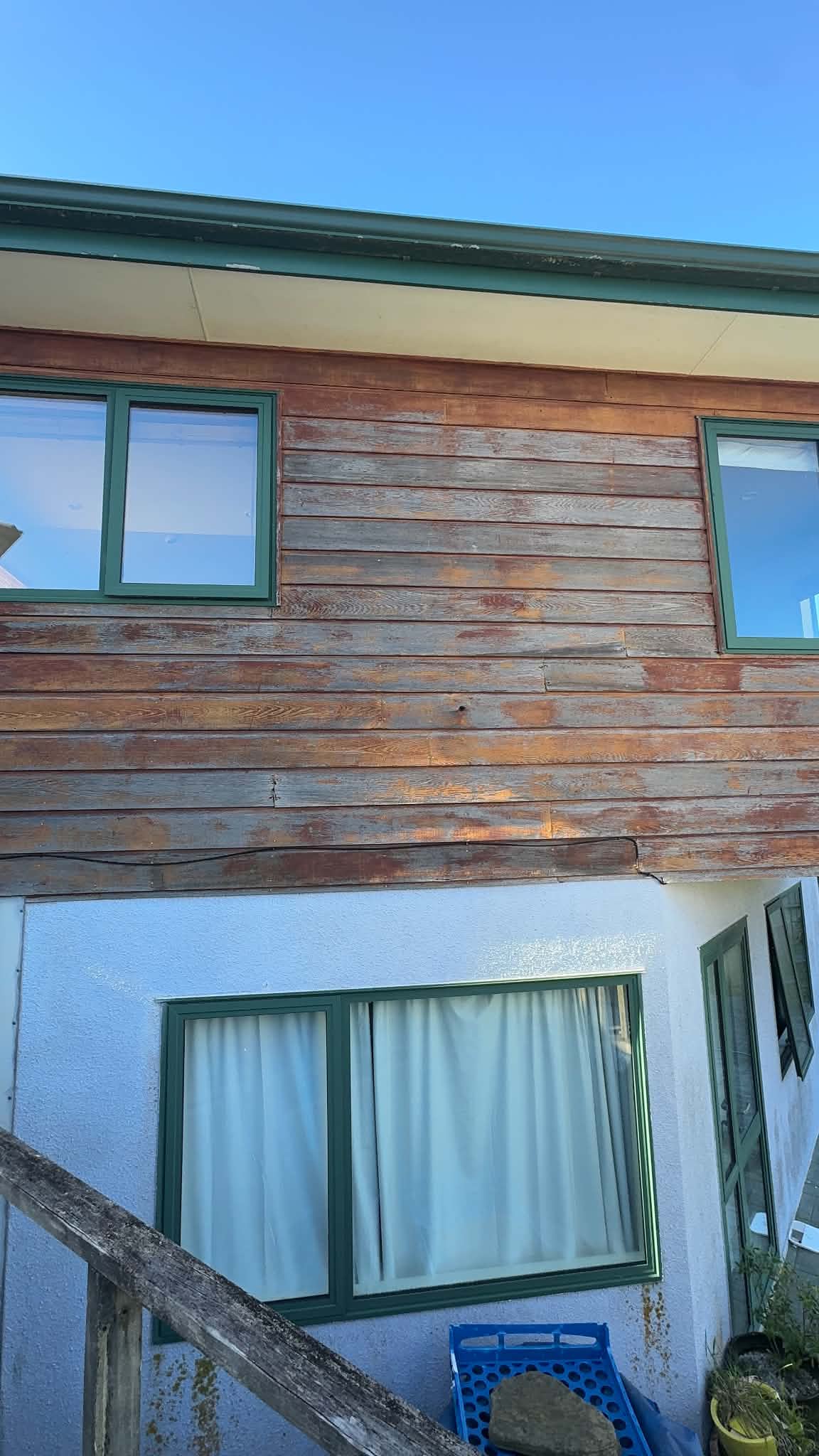 Cedar cladding condition before work began.
